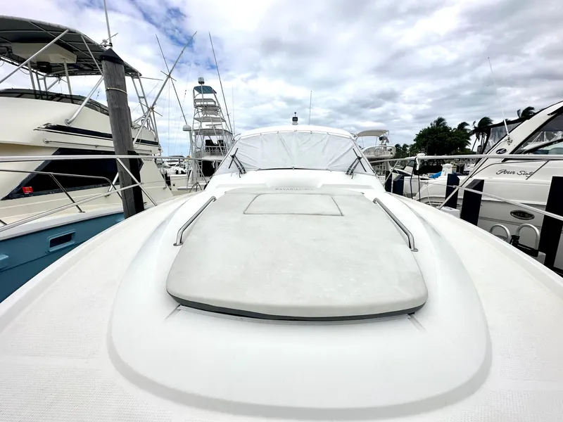 Slide: The Image of 2016 Bavaria Sport 360 HT yacht docked at a marina under a cloudy sky. - 16
