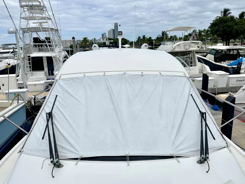 Slide: The Image of 2016 Bavaria Sport 360 HT yacht docked at marina with covered windshield. - 21