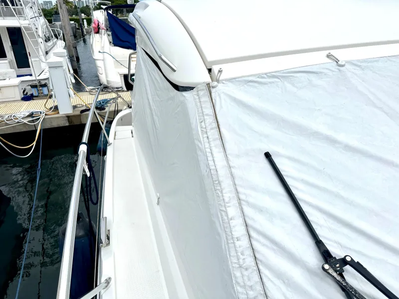 Slide: The Image of 2016 Bavaria Sport 360 HT yacht docked at marina, side view with cover. - 25