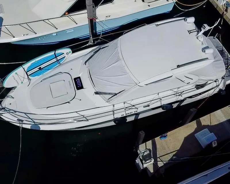 Slide: The Image of 2016 Bavaria Sport 360 HT yacht docked with paddleboard nearby. - 3