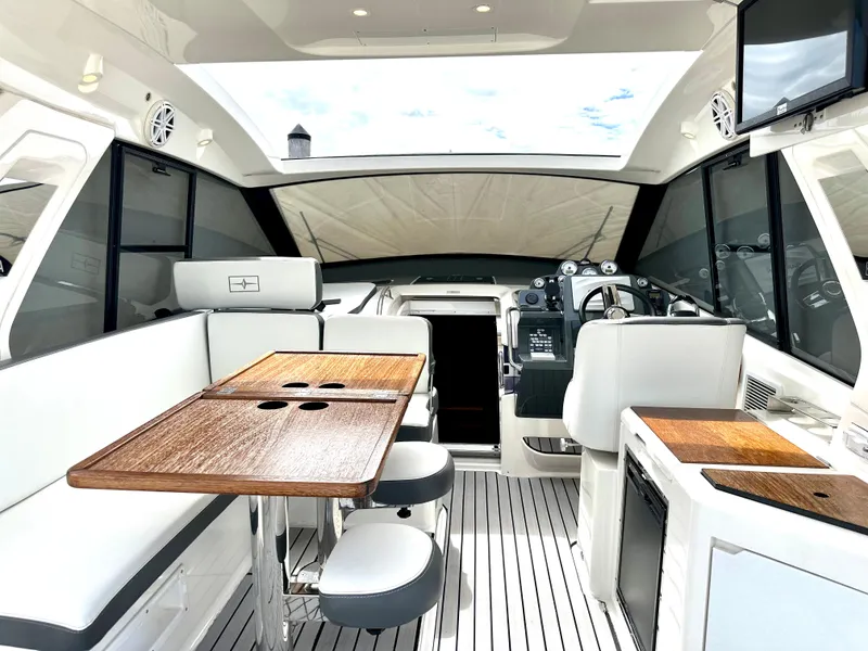 Slide: The Image of Interior of 2016 Bavaria Sport 360 HT yacht with modern seating and dining area. - 31