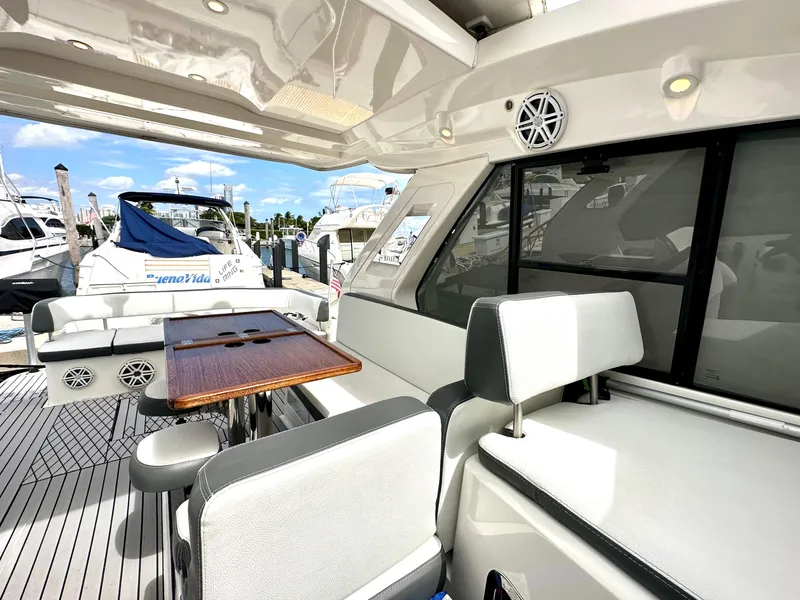 Slide: The Image of 2016 Bavaria Sport 360 HT yacht interior with seating and table at marina. - 42