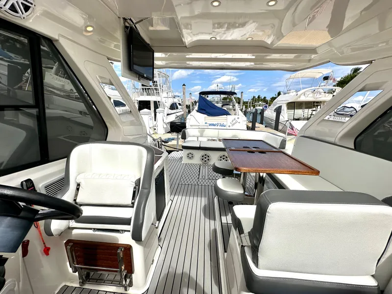 Slide: The Image of Interior of 2016 Bavaria Sport 360 HT yacht with seating and table, docked at marina. - 44