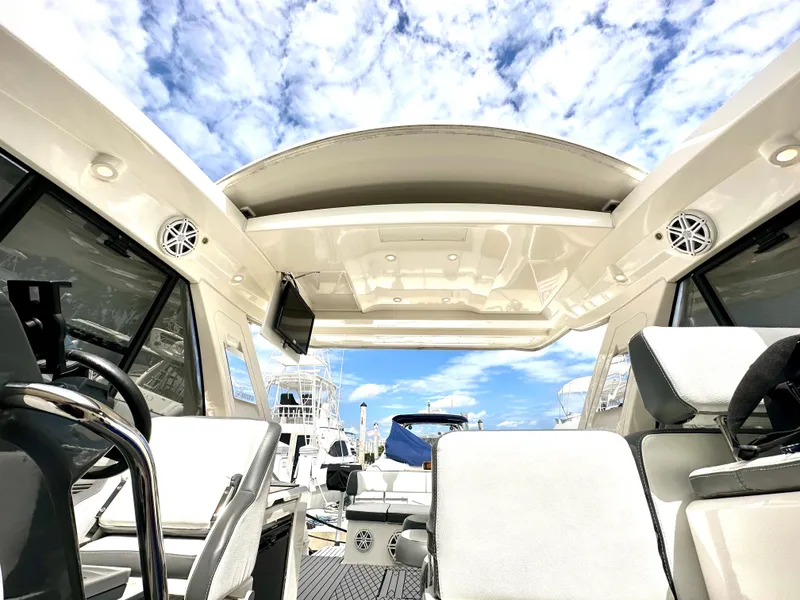 Slide: The Image of 2016 Bavaria Sport 360 HT yacht interior with open sunroof and modern seating. - 45