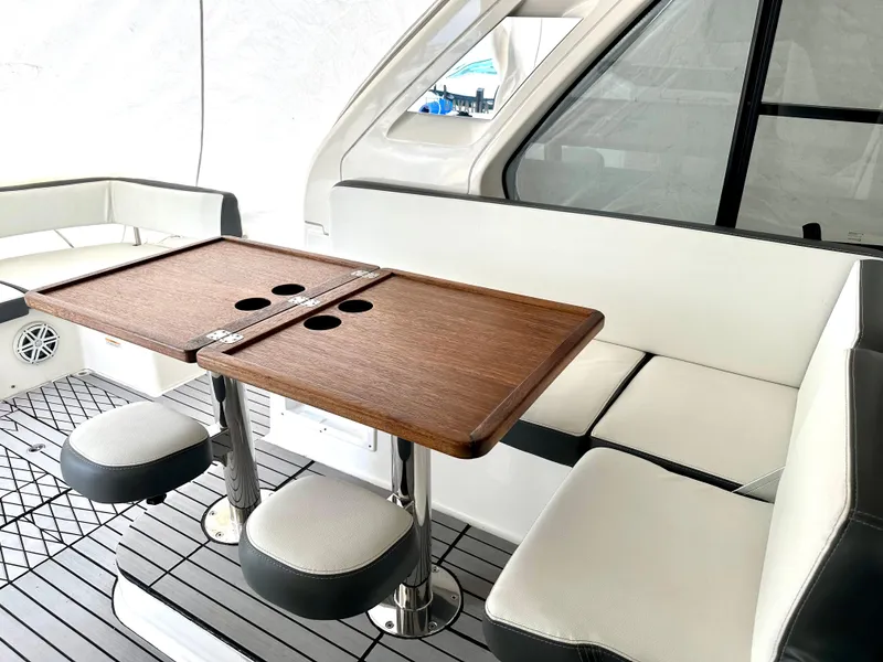 Slide: The Image of Interior seating and table area of a 2016 Bavaria Sport 360 HT yacht. - 49