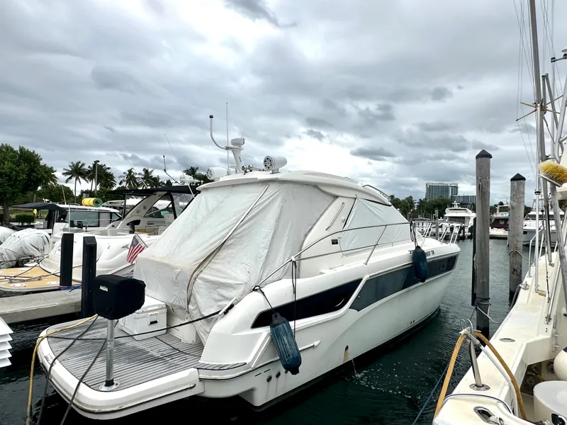 Slide: The Image of 2016 Bavaria Sport 360 HT yacht docked at marina under cloudy sky. - 9