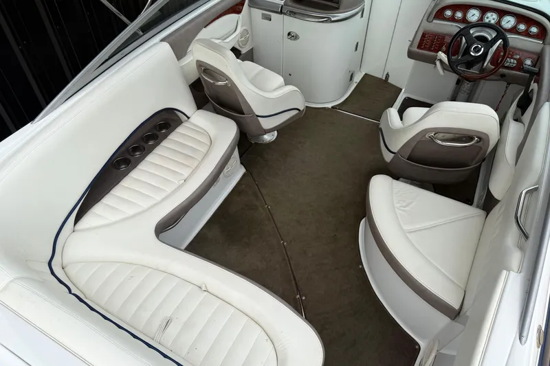 Slide: The Image of Interior of a 2005 Cobalt 240 boat with white and brown seating. - 10