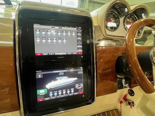 Slide: The Image of 2021 Chris-Craft Launch 35 GT boat in showroom, showcasing sleek design and luxury features. - 11