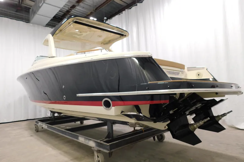 Slide: The Image of 2021 Chris-Craft Launch 35 GT boat in showroom, side view, elegant design. - 15