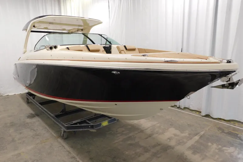 Slide: The Image of 2021 Chris-Craft Launch 35 GT boat in showroom, featuring sleek design and luxury finishes. - 21