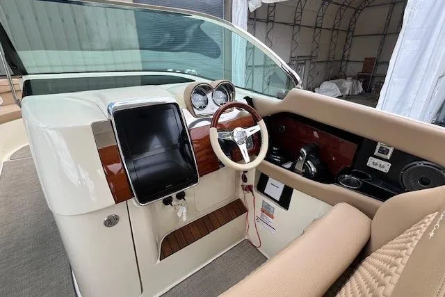 Slide: The Image of 2021 Chris-Craft Launch 35 GT cockpit with elegant steering and dashboard design. - 29