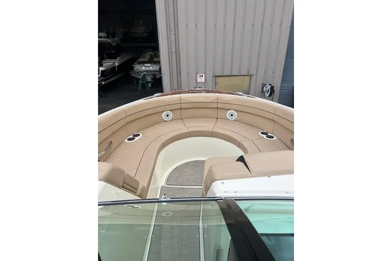 Slide: The Image of 2021 Chris-Craft Launch 35 GT boat with spacious tan seating area. - 35