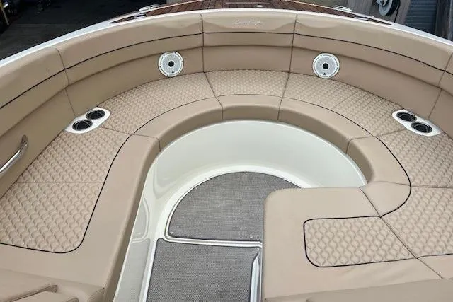 Slide: The Image of Luxurious seating area on 2021 Chris-Craft Launch 35 GT boat, featuring tan upholstery. - 36