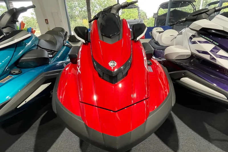 Slide: The Image of 2026 Yamaha WaveRunner FX Cruiser HO in vibrant red, displayed indoors. - 1