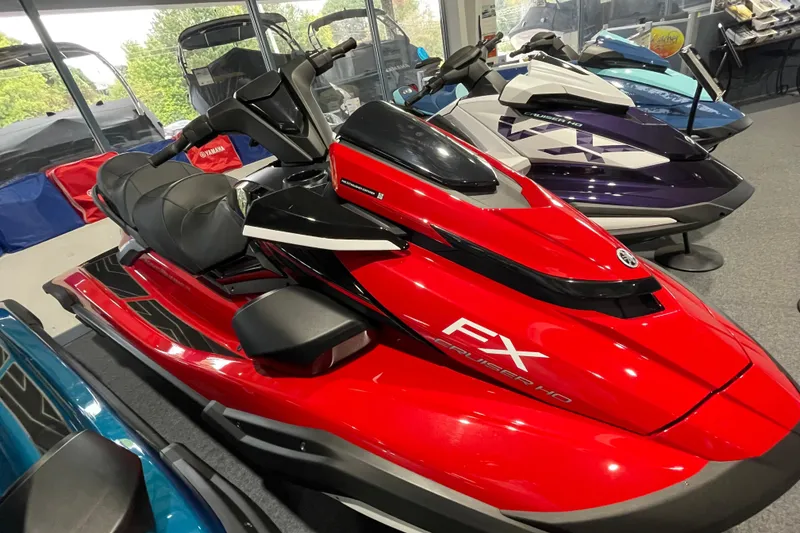 Slide: The Image of 2026 Yamaha WaveRunner FX Cruiser HO in showroom, vibrant red color, sleek design. - 3
