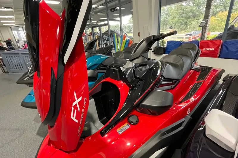 Slide: The Image of 2026 Yamaha WaveRunner FX Cruiser HO in showroom, featuring sleek red and black design. - 4