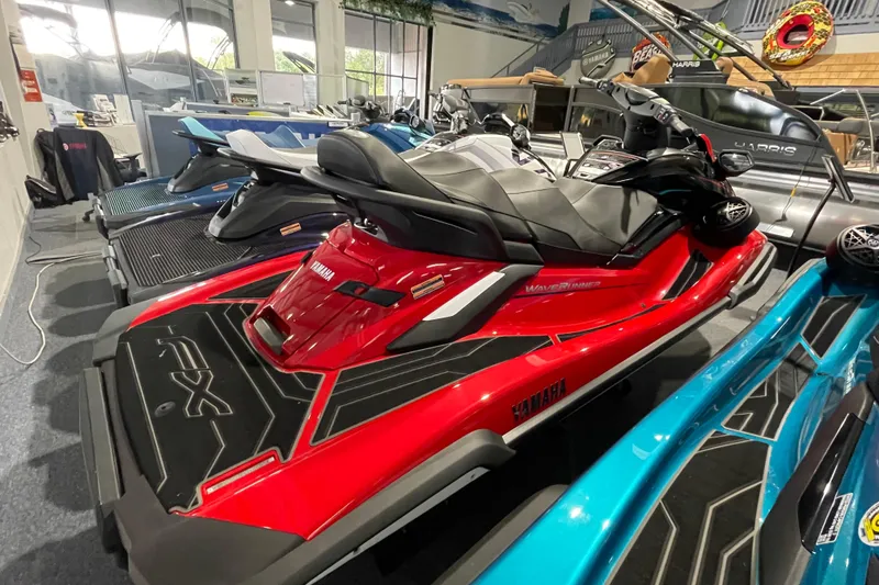 Slide: The Image of 2026 Yamaha WaveRunner FX Cruiser HO in showroom, red and black design. - 6