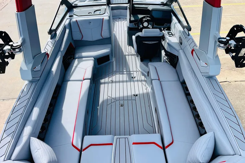 Slide: The Image of 2026 Nautique Super Air Nautique G25 interior with sleek seating and modern design. - 14