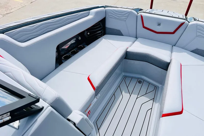 Slide: The Image of 2026 Nautique Super Air Nautique G25 interior with sleek seating and modern design. - 16