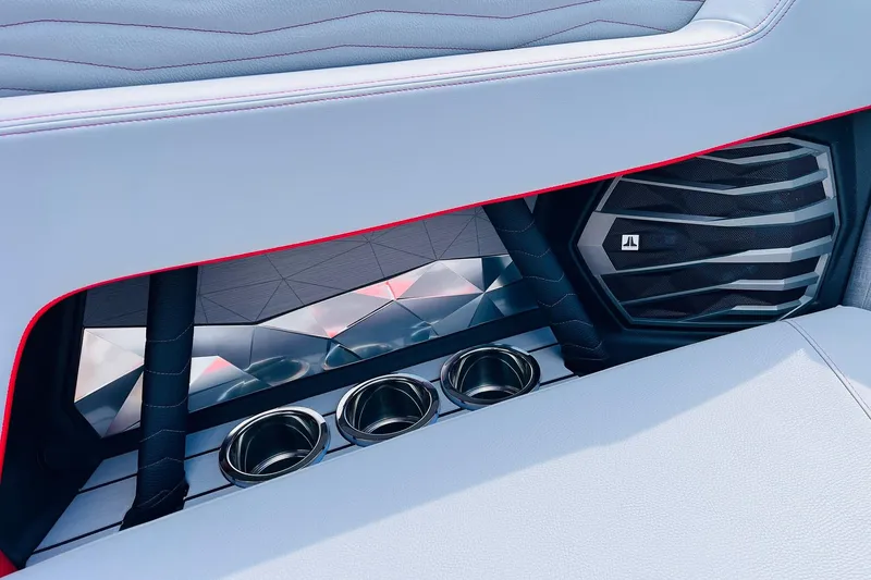 Slide: The Image of Interior of 2026 Nautique Super Air Nautique G25 with speaker and cup holders. - 26