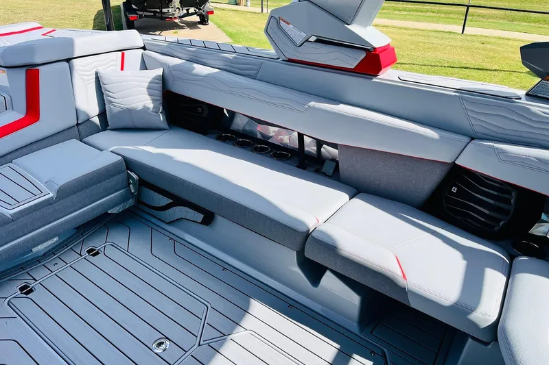 Slide: The Image of Luxurious interior of 2026 Nautique Super Air Nautique G25 boat with plush seating. - 38