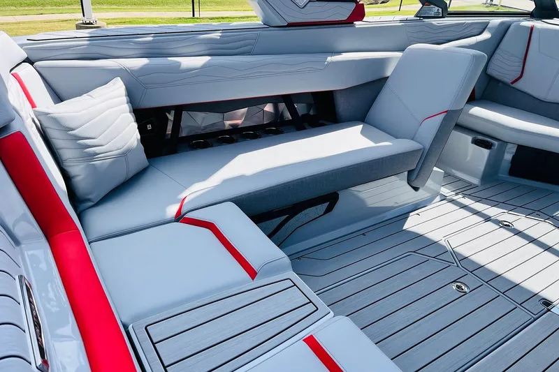 Slide: The Image of 2026 Nautique Super Air Nautique G25 interior with sleek gray and red seating. - 41
