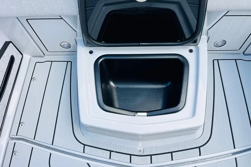 Slide: The Image of 2026 Nautique Super Air Nautique G25 storage compartment on sleek deck. - 50