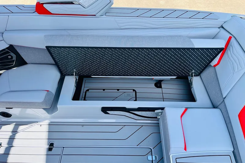 Slide: The Image of 2026 Nautique Super Air Nautique G25 interior storage compartment with sleek seating design. - 53