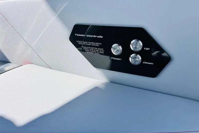 Slide: The Image of 2026 Nautique Super Air Nautique G25 tower controls on white leather interior. - 62