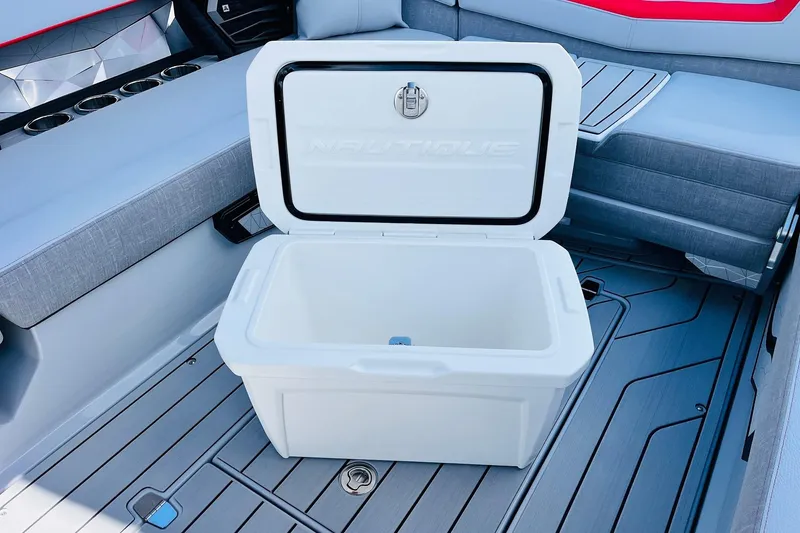 Slide: The Image of Open cooler on 2026 Nautique Super Air Nautique G25 boat interior. - 67