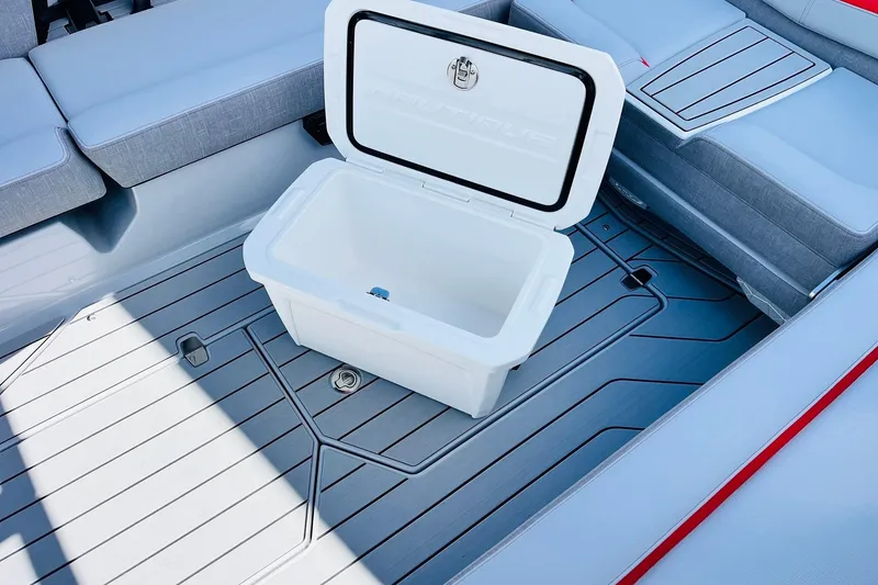Slide: The Image of 2026 Nautique Super Air Nautique G25 interior with open cooler on deck. - 68