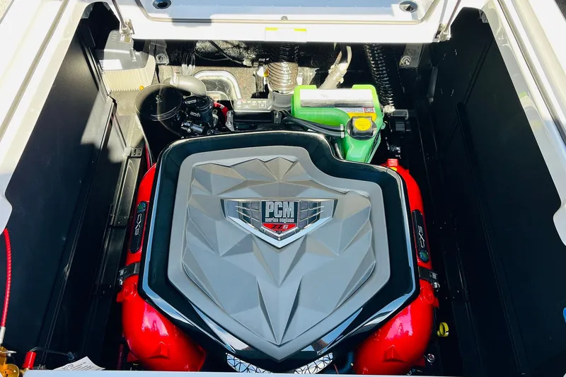 Slide: The Image of Engine compartment of 2026 Nautique Super Air Nautique G25, featuring PCM engine components. - 78