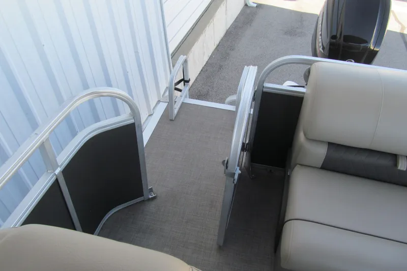 Slide: The Image of 2022 Sun Tracker Party Barge 20 DLX interior with seating and railing. - 12