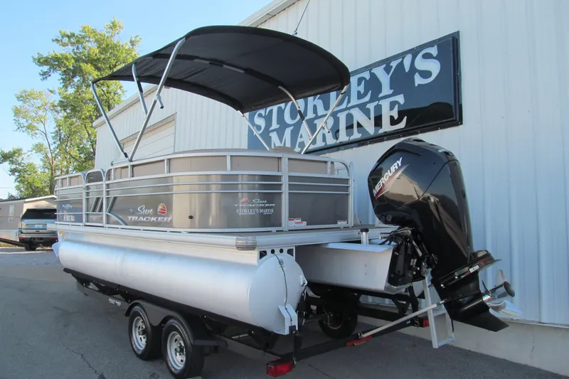 Slide: The Image of 2022 Sun Tracker Party Barge 20 DLX pontoon boat with Mercury engine at dealership. - 3