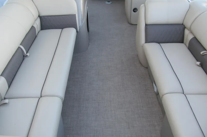 Slide: The Image of 2022 Sun Tracker Party Barge 20 DLX interior with gray cushioned seating. - 8