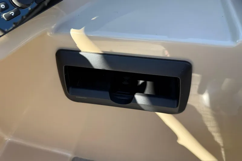 Slide: The Image of 2026 Bentley Pontoons Legacy 223 Swingback dashboard with built-in storage compartment. - 10