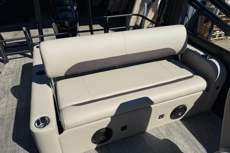 Slide: The Image of 2026 Bentley Pontoons Legacy 223 Swingback with beige seating and cup holders. - 11
