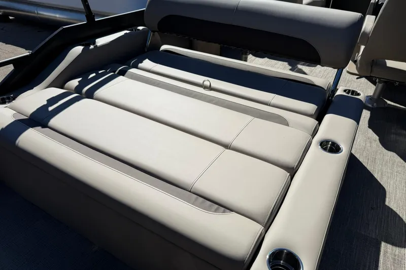Slide: The Image of 2026 Bentley Pontoons Legacy 223 Swingback with luxurious seating and cup holders. - 12
