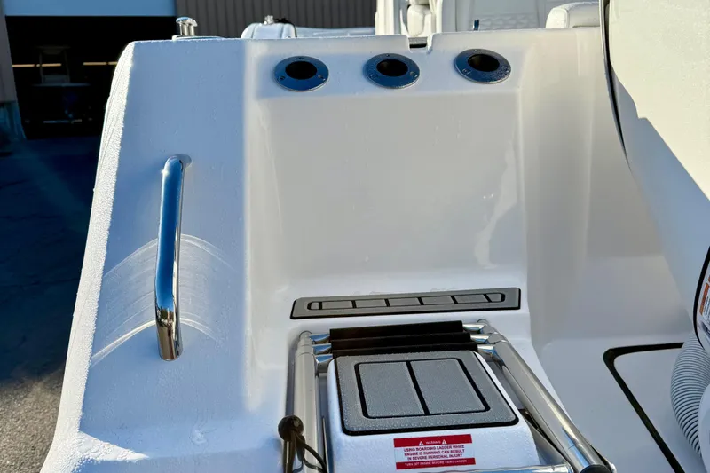 Slide: The Image of 2026 Tidewater 282 CC Adventure boat ladder and handle detail. - 15