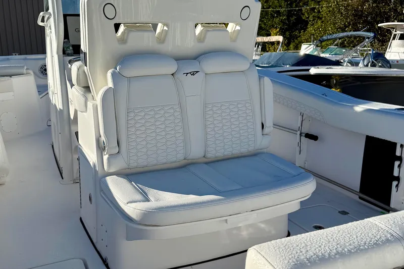 Slide: The Image of 2026 Tidewater 282 CC Adventure boat with luxurious white seating and modern design. - 18