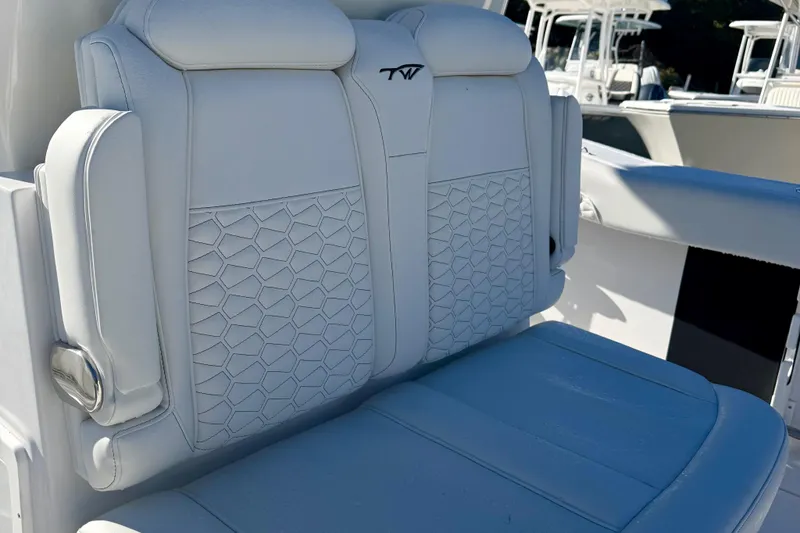 Slide: The Image of 2026 Tidewater 282 CC Adventure boat seat with hexagonal pattern and logo. - 19