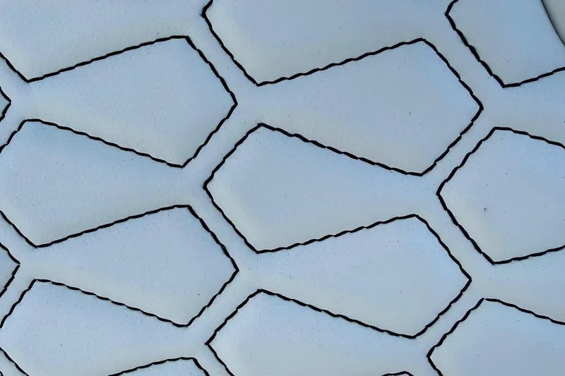Slide: The Image of Close-up of hexagonal pattern on 2026 Tidewater 282 CC Adventure boat upholstery. - 24