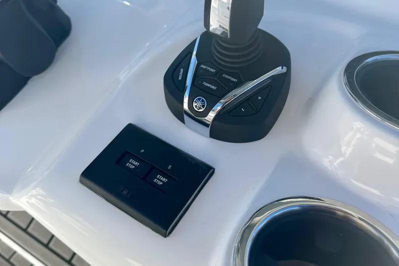 Slide: The Image of Control panel of 2026 Tidewater 282 CC Adventure boat with joystick and start/stop buttons. - 30