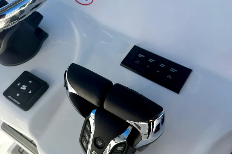 Slide: The Image of Close-up of 2026 Tidewater 282 CC Adventure boat controls and dashboard. - 31