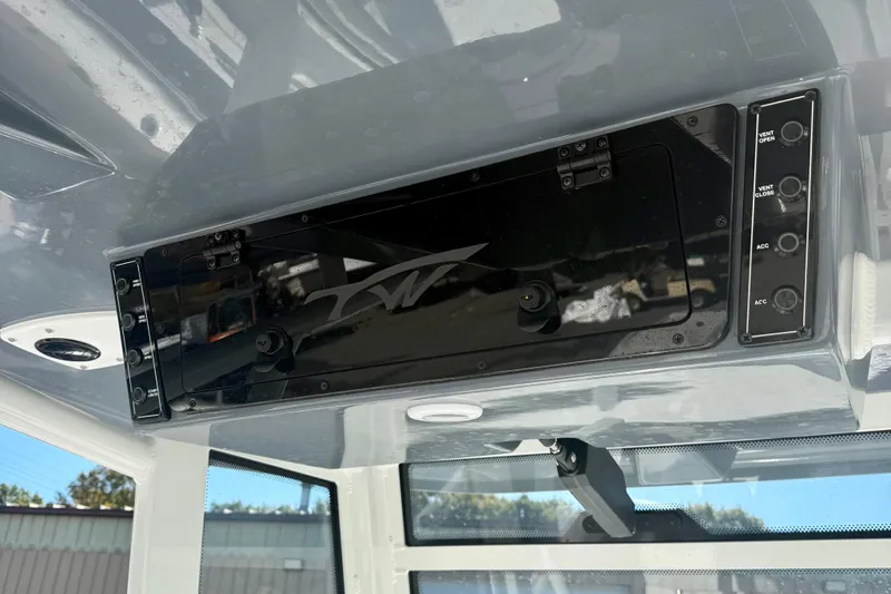 Slide: The Image of 2026 Tidewater 282 CC Adventure boat console with control panel and switches. - 34