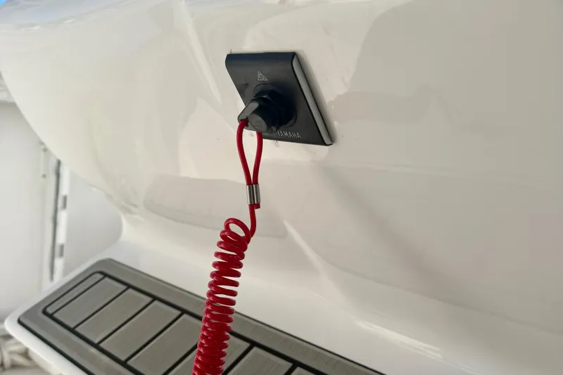 Slide: The Image of Red safety lanyard on 2026 Tidewater 282 CC Adventure boat. - 37