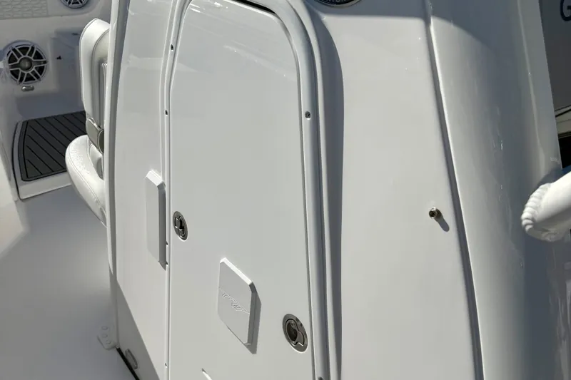 Slide: The Image of 2026 Tidewater 282 CC Adventure boat interior, featuring sleek white paneling and modern design elements. - 38