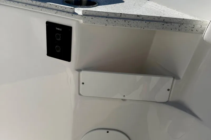 Slide: The Image of 2026 Tidewater 282 CC Adventure boat interior with table control panel and countertop. - 47