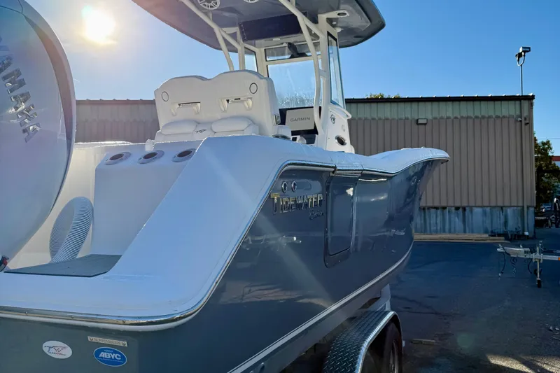 Slide: The Image of 2026 Tidewater 282 CC Adventure boat with Yamaha engine in a sunny outdoor setting. - 5