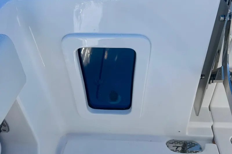 Slide: The Image of 2026 Tidewater 282 CC Adventure boat window detail with sleek design. - 61